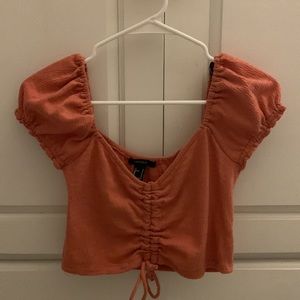 Pink crop top with puff sleeves